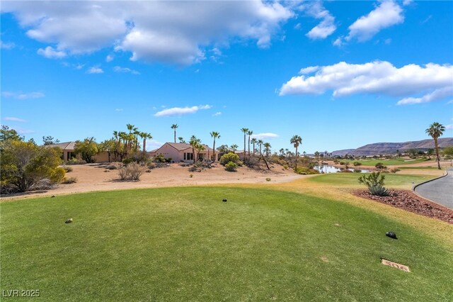 4963 Pensier St, Las Vegas, NV 89135 - view of community with a lawn, golf course view, and a water and mountain view