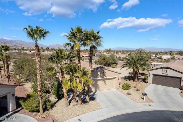 birds eye view of property with a mountain view