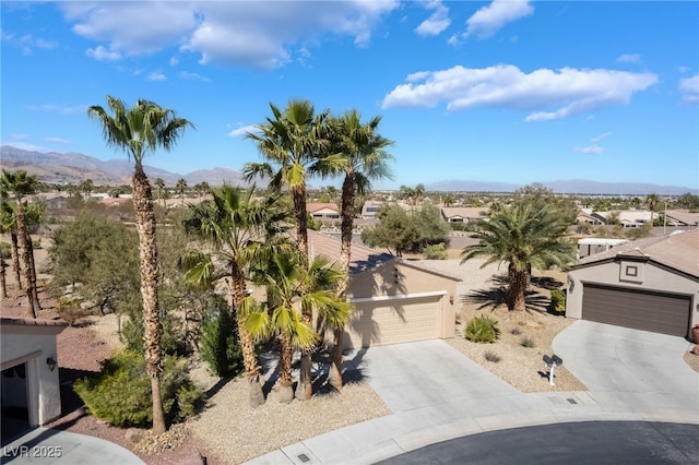 4963 Pensier St, Las Vegas, NV 89135 - exterior space with a garage, stucco siding, a mountain view, and a residential view