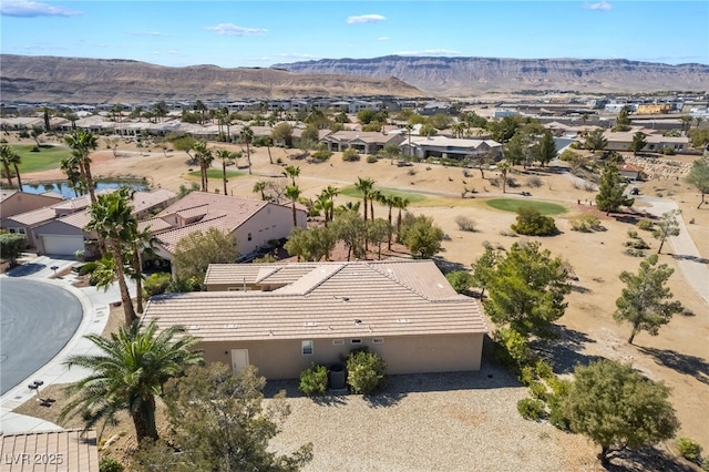 aerial view featuring a mountain view and a residential view