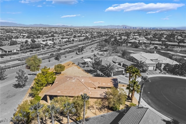 birds eye view of property featuring a mountain view and a residential view