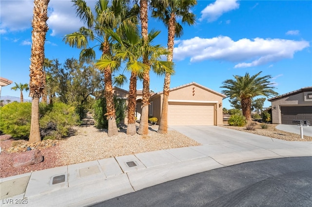 4963 Pensier St, Las Vegas, NV 89135 - view of front of property featuring concrete driveway, a garage, and stucco siding