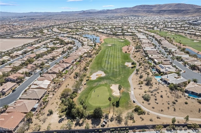 birds eye view of property featuring a mountain view, golf course view, and a residential view