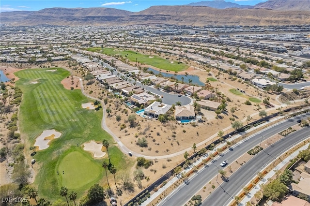 aerial view with a mountain view, a residential view, and golf course view