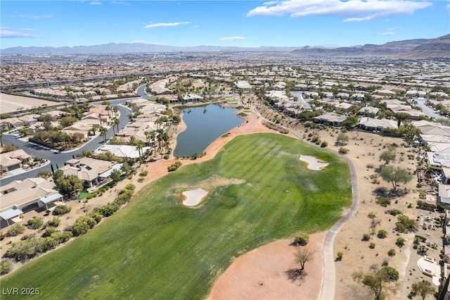 drone / aerial view featuring a residential view, a water and mountain view, and view of golf course