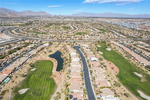 birds eye view of property featuring golf course view and a mountain view