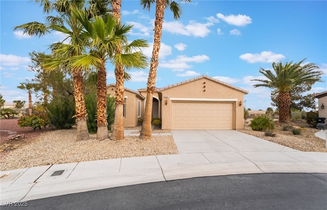 4963 Pensier St, Las Vegas, NV 89135 - view of front facade featuring driveway, stucco siding, and a garage