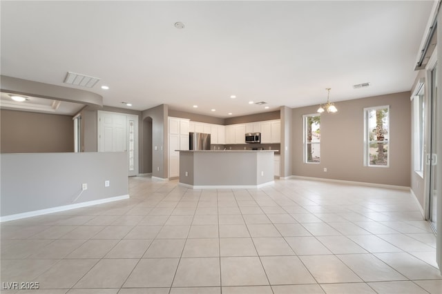 4963 Pensier St, Las Vegas, NV 89135 - unfurnished living room with recessed lighting, light tile patterned floors, visible vents, a chandelier, and arched walkways