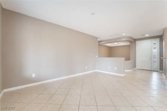 4963 Pensier St, Las Vegas, NV 89135 - unfurnished room with light tile patterned floors, baseboards, arched walkways, and recessed lighting