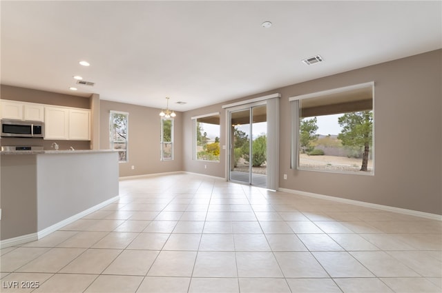 4963 Pensier St, Las Vegas, NV 89135 - unfurnished living room featuring light tile patterned floors, a chandelier, visible vents, and recessed lighting