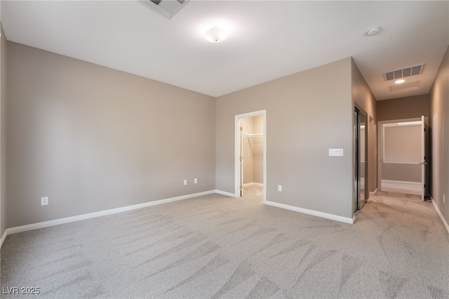 4963 Pensier St, Las Vegas, NV 89135 - unfurnished bedroom featuring baseboards, a spacious closet, light carpet, and visible vents