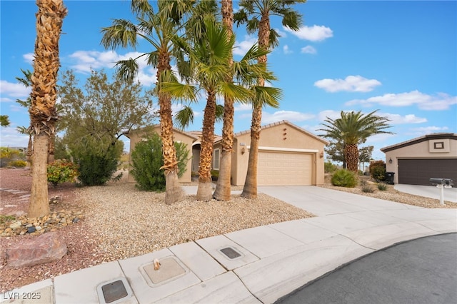 4963 Pensier St, Las Vegas, NV 89135 - mediterranean / spanish house featuring concrete driveway, stucco siding, and a garage