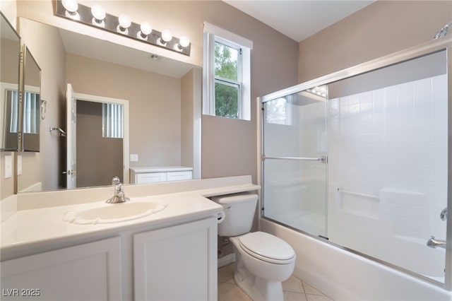 4963 Pensier St, Las Vegas, NV 89135 - full bath with tile patterned floors, toilet, vanity, and shower / bath combination with glass door