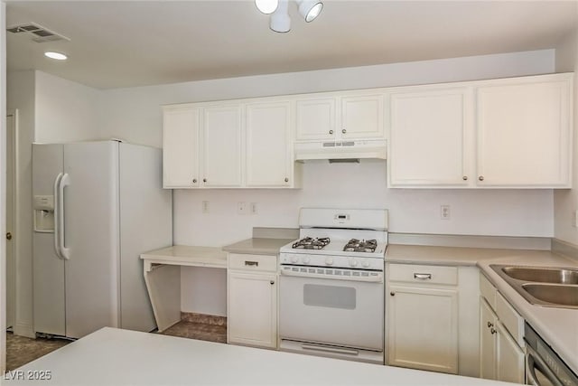 kitchen with white appliances, visible vents, light countertops, white cabinets, and under cabinet range hood