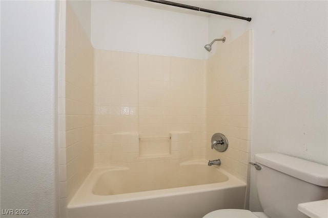 full bathroom featuring tub / shower combination and toilet