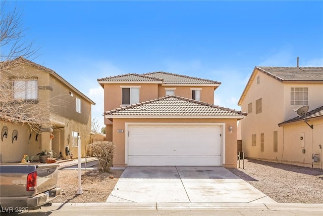 view of front of home with a tiled roof, an attached garage, driveway, and stucco siding