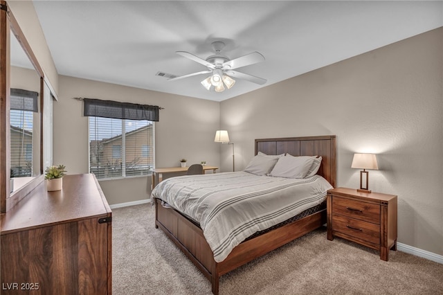 bedroom featuring light colored carpet, visible vents, and baseboards