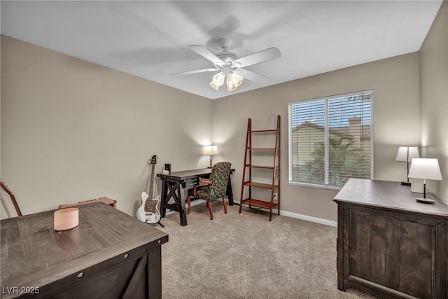 home office with a ceiling fan, light colored carpet, and baseboards