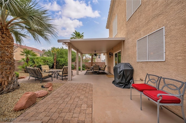 view of patio with an outdoor living space, area for grilling, and fence