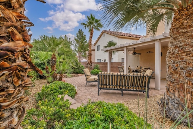 view of patio with a ceiling fan, fence, and an outdoor hangout area