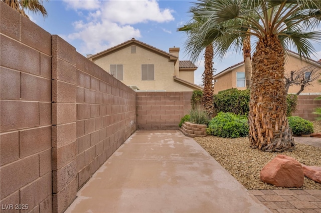 view of patio featuring fence