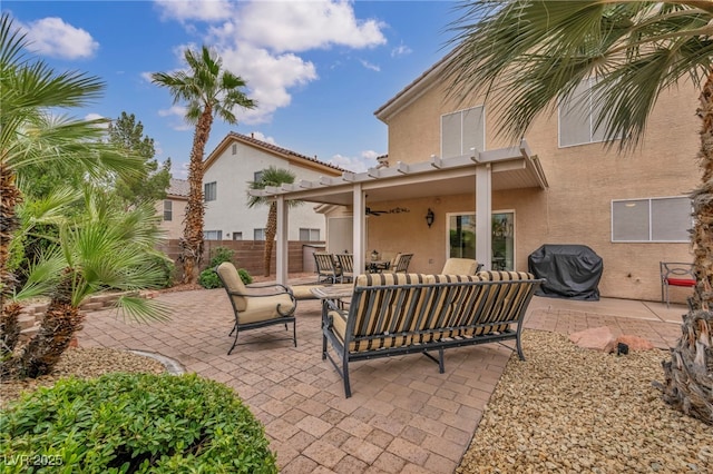 view of patio featuring an outdoor living space, grilling area, ceiling fan, and fence