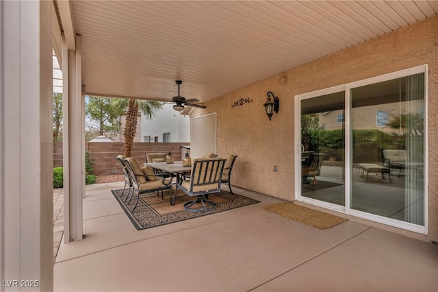 view of patio / terrace featuring outdoor dining area, fence, and ceiling fan