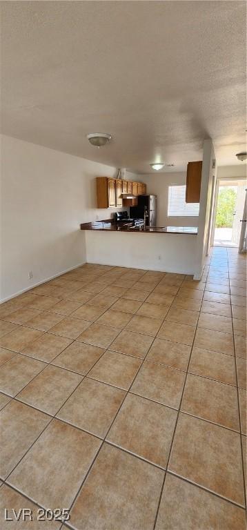 510 Holick Ave, Henderson, NV 89011 - unfurnished living room featuring light tile patterned flooring