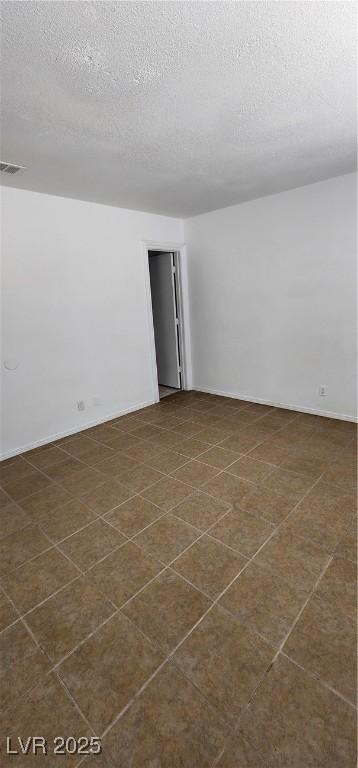510 Holick Ave, Henderson, NV 89011 - empty room with a textured ceiling