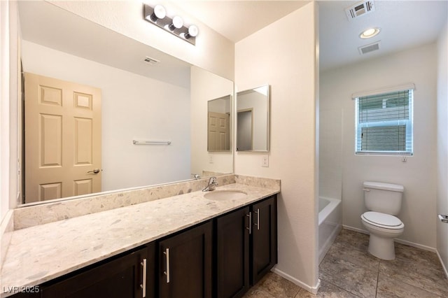 full bathroom with vanity, toilet, and visible vents