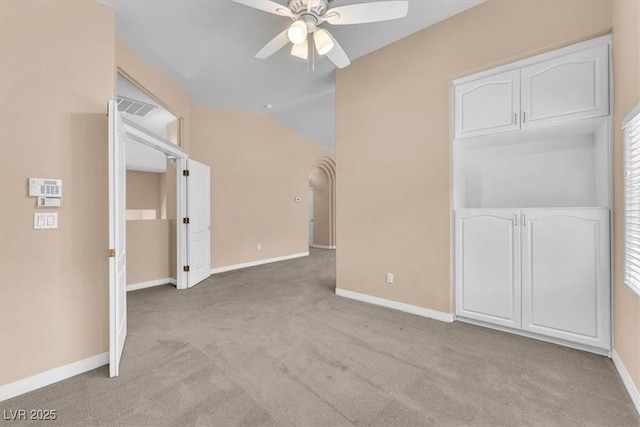 empty room featuring baseboards, carpet, and a ceiling fan