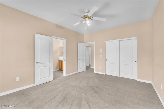 unfurnished bedroom featuring carpet flooring, baseboards, a closet, and ceiling fan