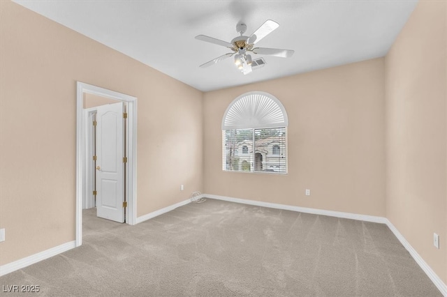 unfurnished room with baseboards, carpet, and ceiling fan