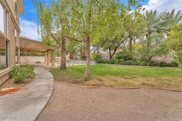 view of yard with a patio and fence