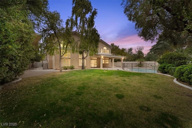 exterior space with a yard, a patio, and fence