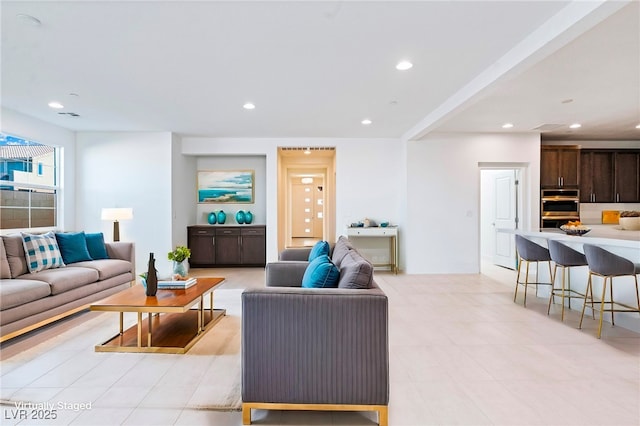 living room with recessed lighting and visible vents