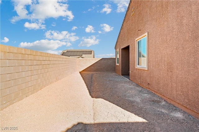 view of home's exterior featuring stucco siding and a fenced backyard