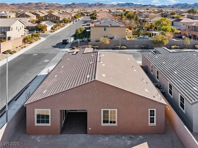 birds eye view of property featuring a residential view and a mountain view