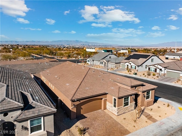 birds eye view of property featuring a residential view and a mountain view