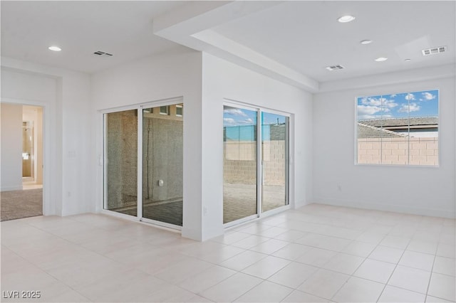 spare room with recessed lighting, visible vents, and tile patterned flooring