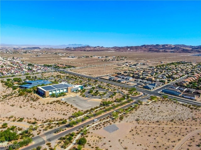 aerial view featuring view of desert and a mountain view