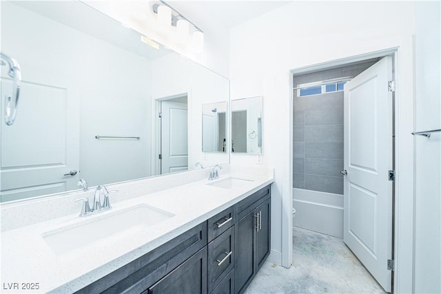 full bathroom featuring a sink, toilet, tub / shower combination, and double vanity