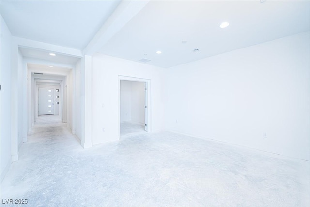 unfurnished room with recessed lighting