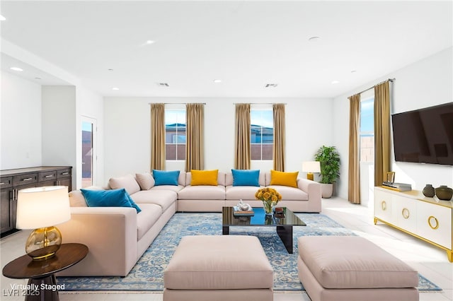 living area with plenty of natural light, recessed lighting, and visible vents