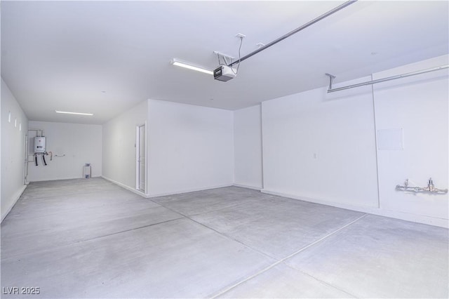 garage with a garage door opener and water heater