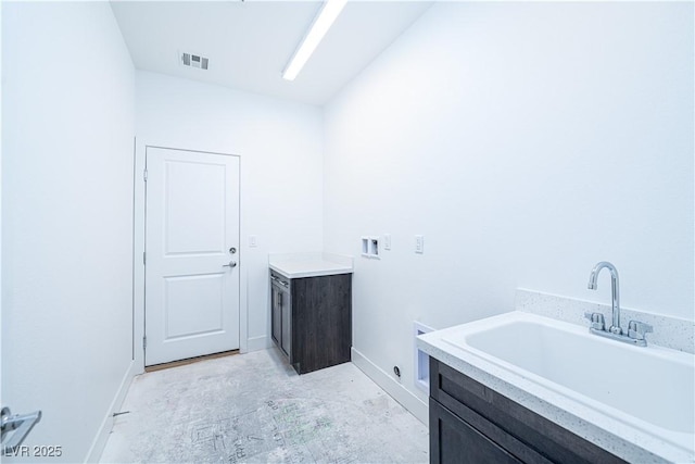 laundry area with visible vents, washer hookup, a sink, cabinet space, and hookup for an electric dryer