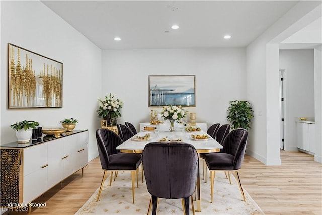 dining room featuring recessed lighting, baseboards, and light wood-style flooring