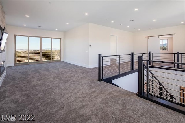 carpeted empty room with recessed lighting and baseboards