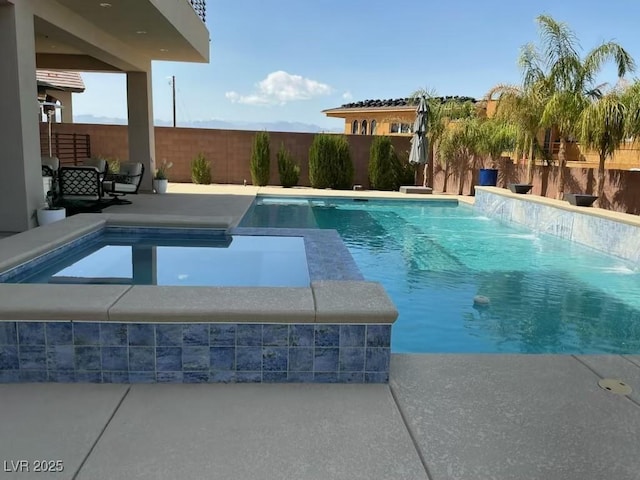 view of swimming pool with a patio, a fenced in pool, a fenced backyard, and an in ground hot tub