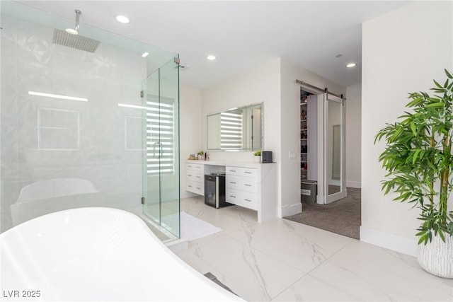 bathroom featuring vanity, recessed lighting, marble finish floor, a stall shower, and a freestanding bath